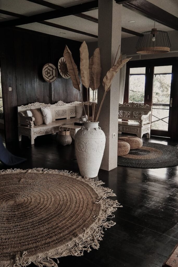 Cozy rustic living room with natural decor and vintage furniture, bathed in sunlight.